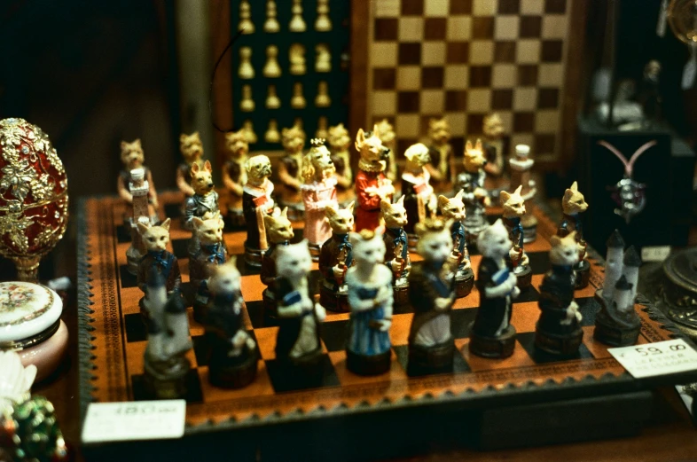 this is a chess set on display with an open bottle