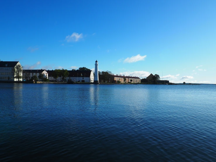 buildings are on the shore of the lake