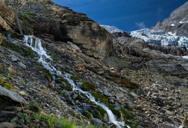 a very big pretty waterfall near some rocks