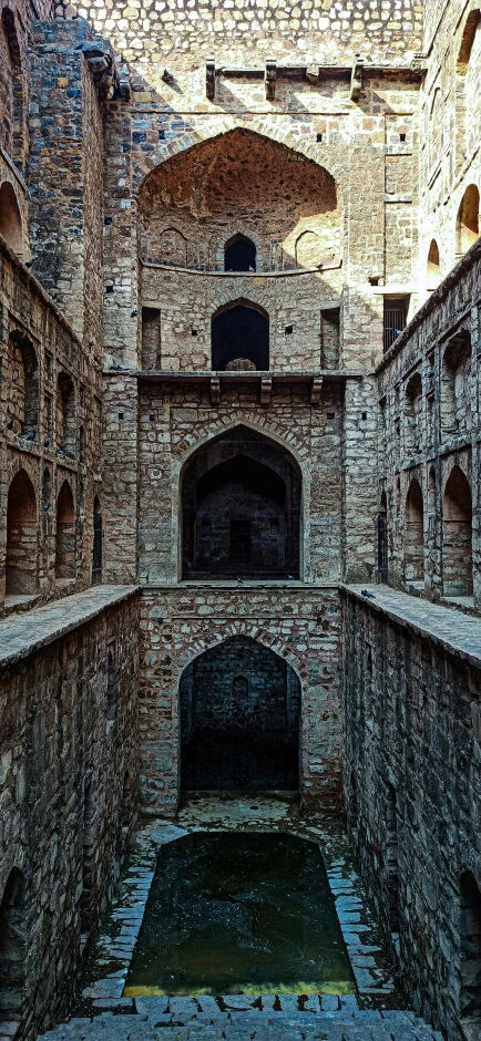 an old, empty building is shown with some light on it