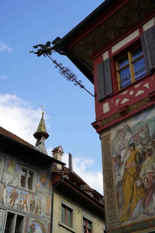 the building is decorated with pictures and a steeple