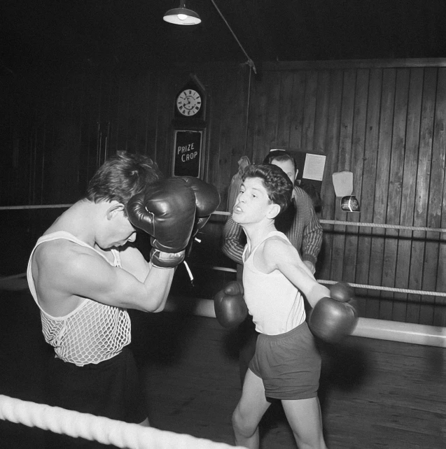 black and white pograph of women in boxing ring