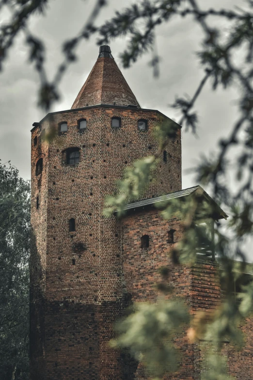 a large tower that is next to trees