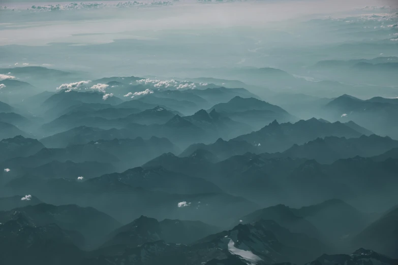 the view of some hills, and some clouds