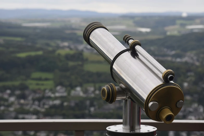 a telescope on top of a metal stand