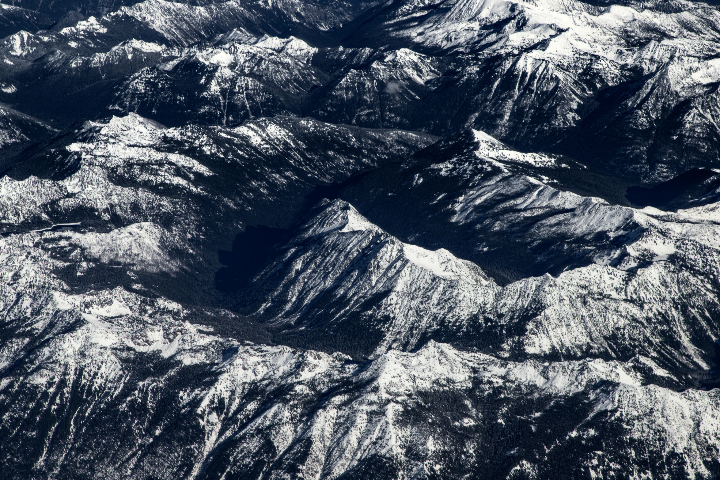 a large amount of snow is on top of the mountain range