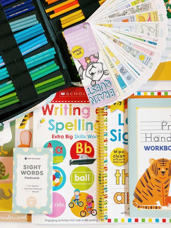 a child's drawing book and many school supplies