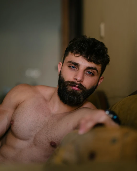 a young man with  sitting on the couch