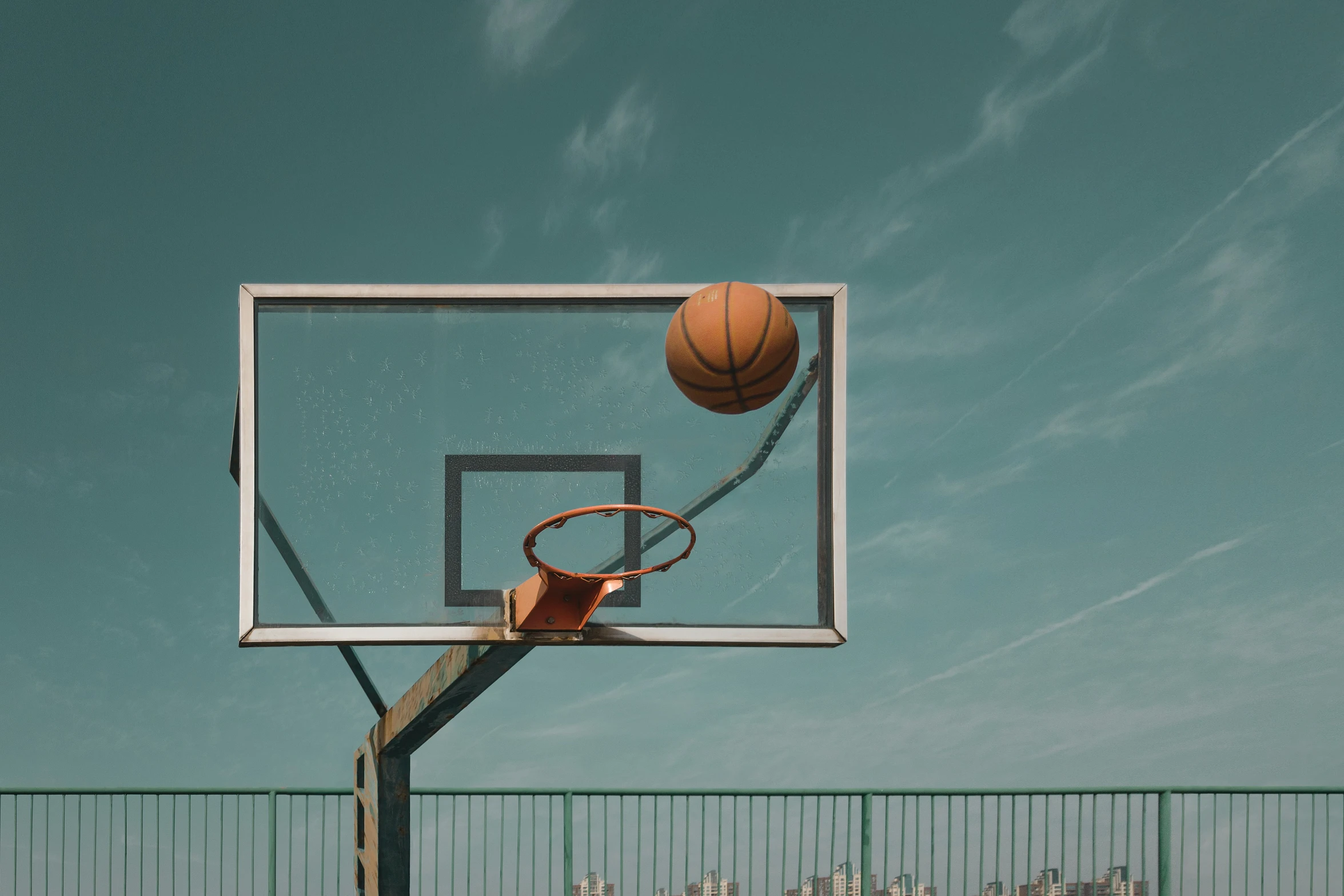 basketball being thrown into a basket at the basket net