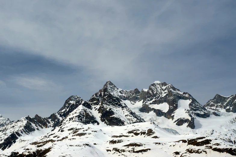 a snowy mountain range with lots of snow on it