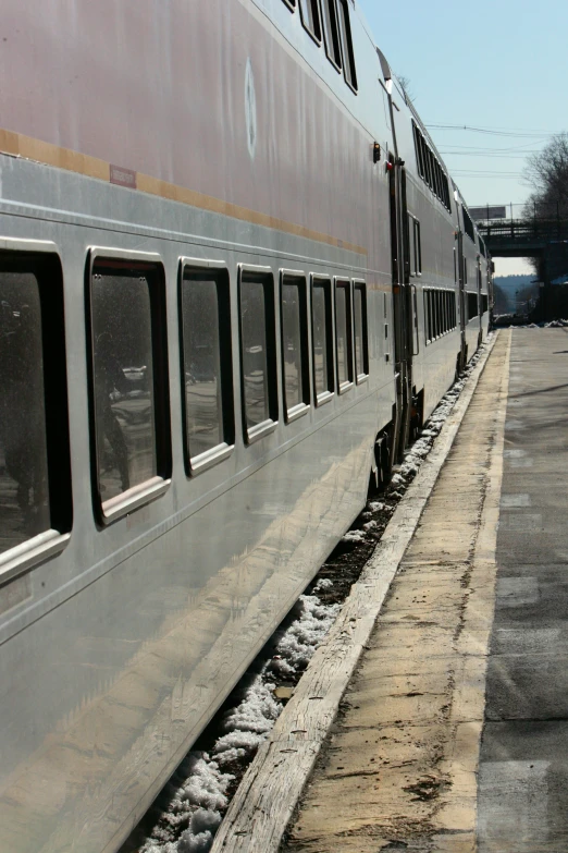 the side of a passenger train on the rails