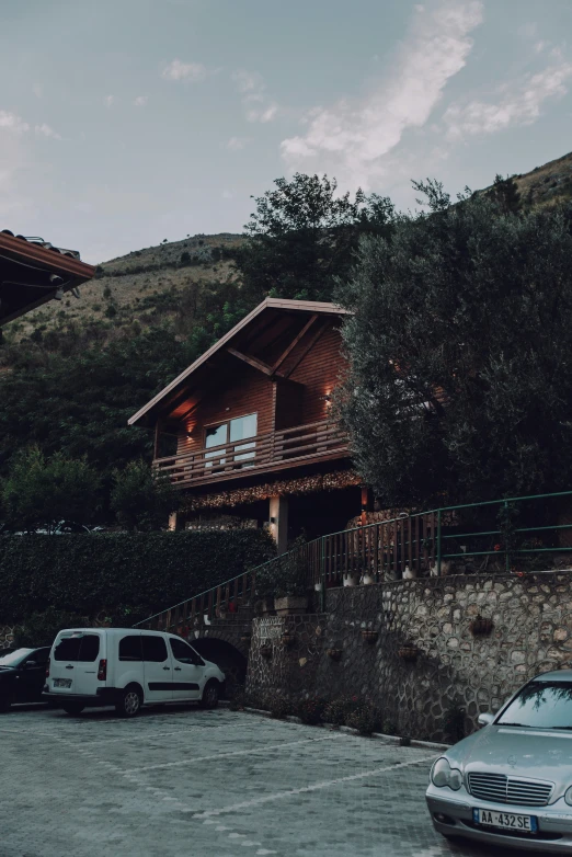 a house and several parked cars in the driveway