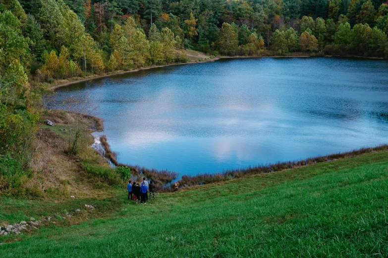 a large body of water with trees around it