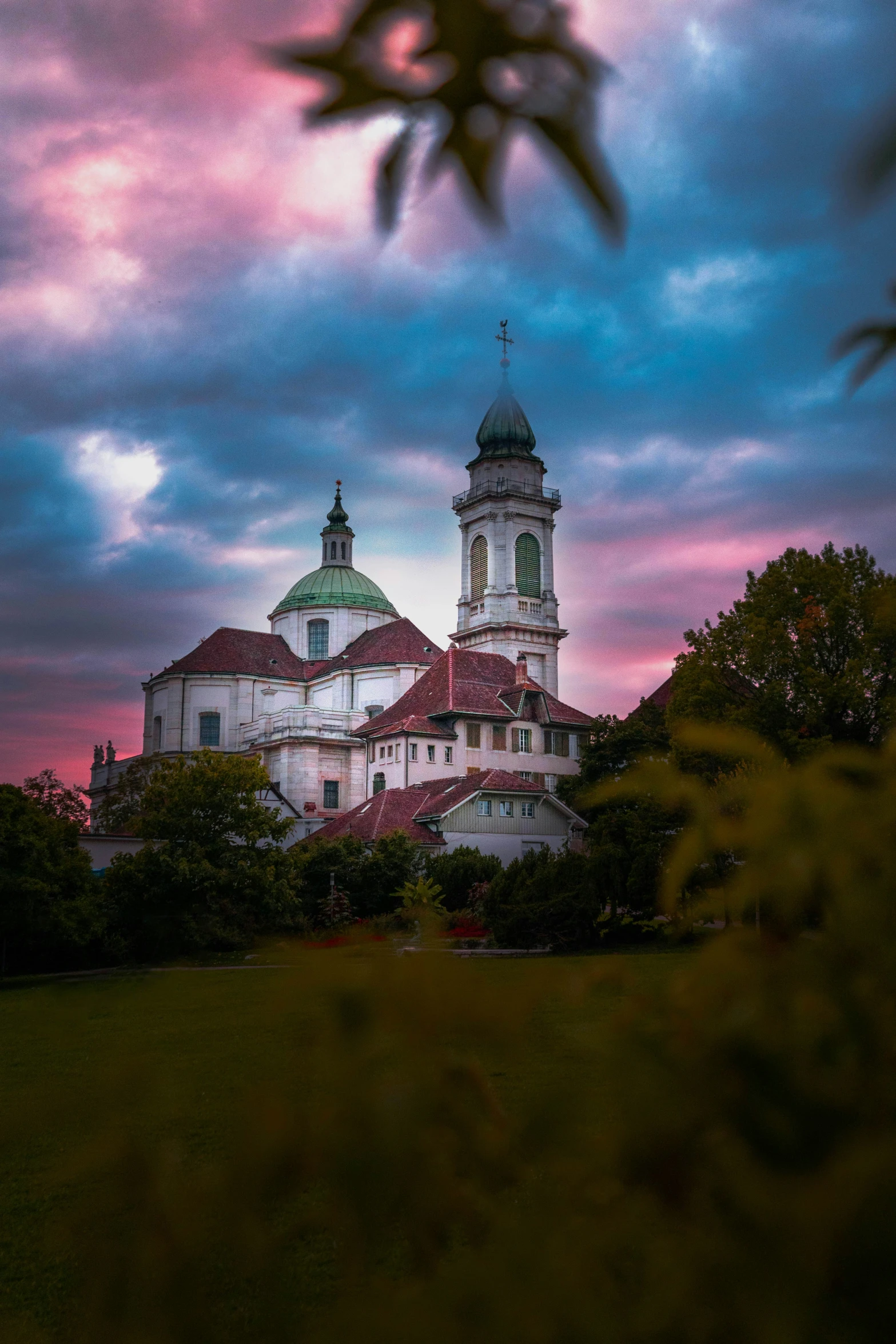 the old building is illuminated by an evening sky