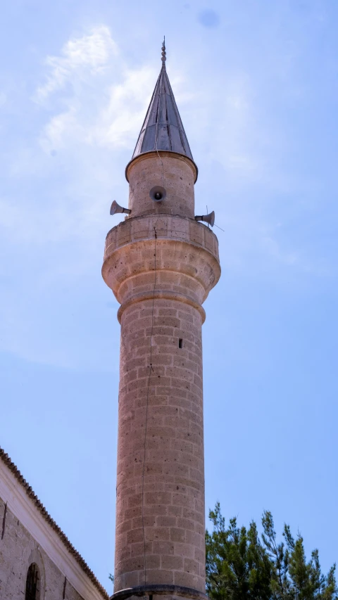 a very tall white tower with a clock on top