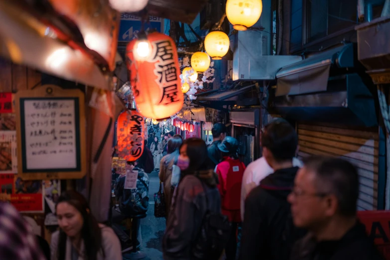 a busy shopping area with people walking around