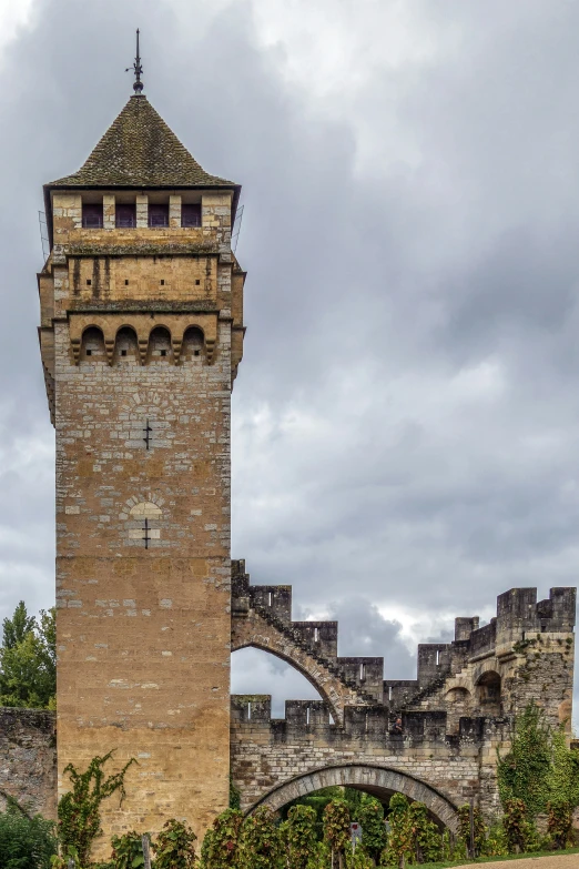 a tower stands against an overcast sky