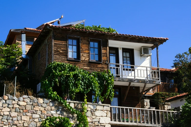 the exterior of a house with balconyes, brick and stucco walling