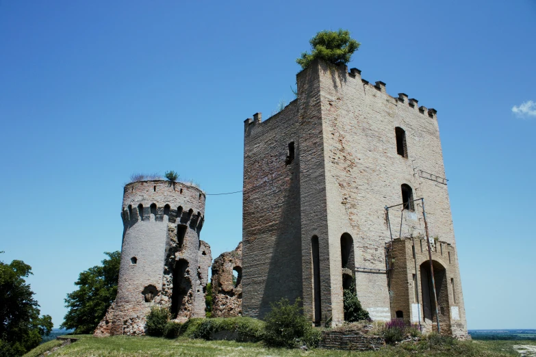 an old ruin sits in the middle of a field