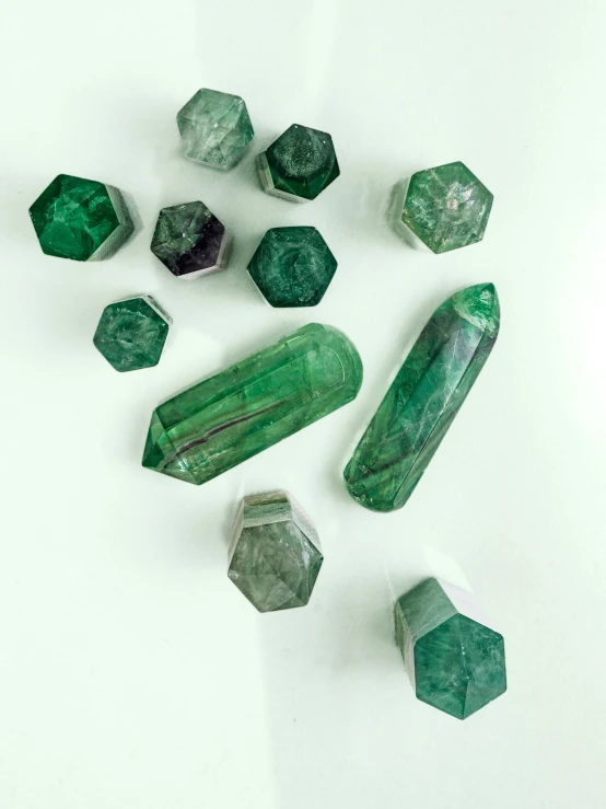 several green crystals on a table top
