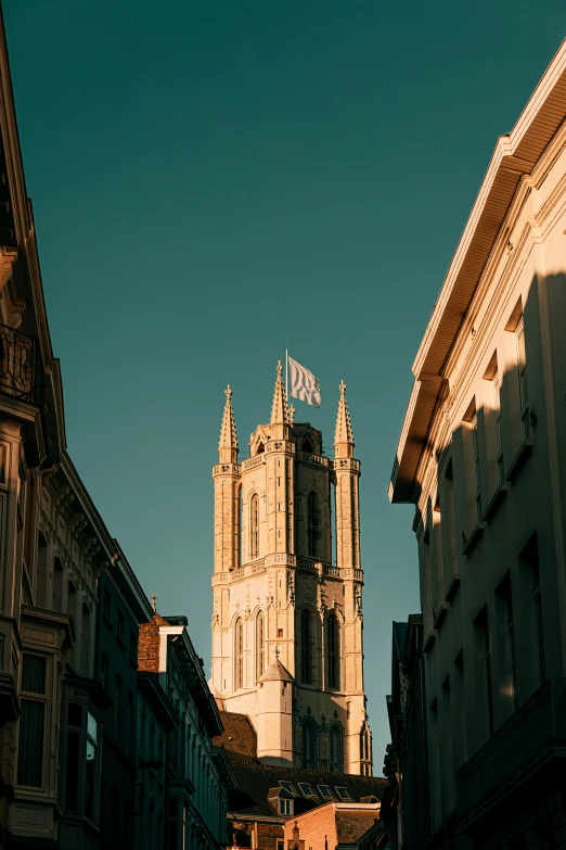 a cathedral that is standing tall and has a sky background