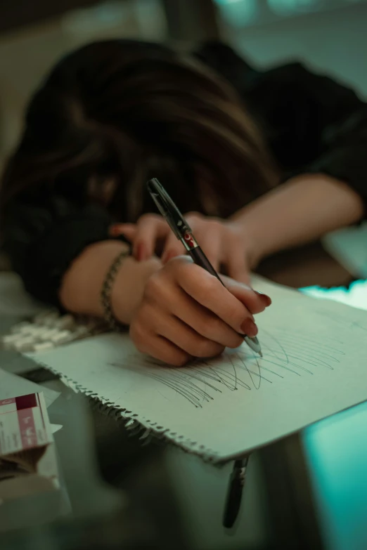 a person that is writing on paper