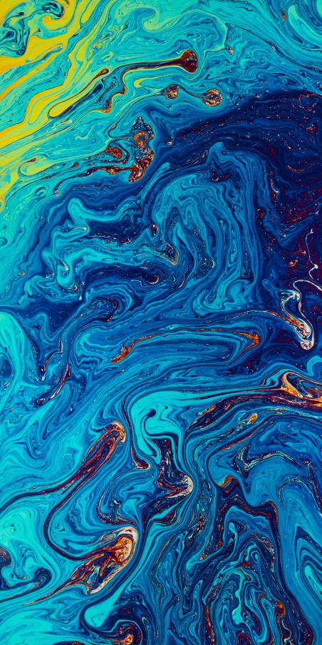 some colorful fluid paint is on the surface