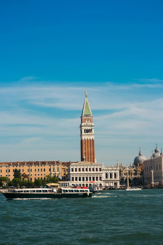 the ship passes under the clock tower in the city