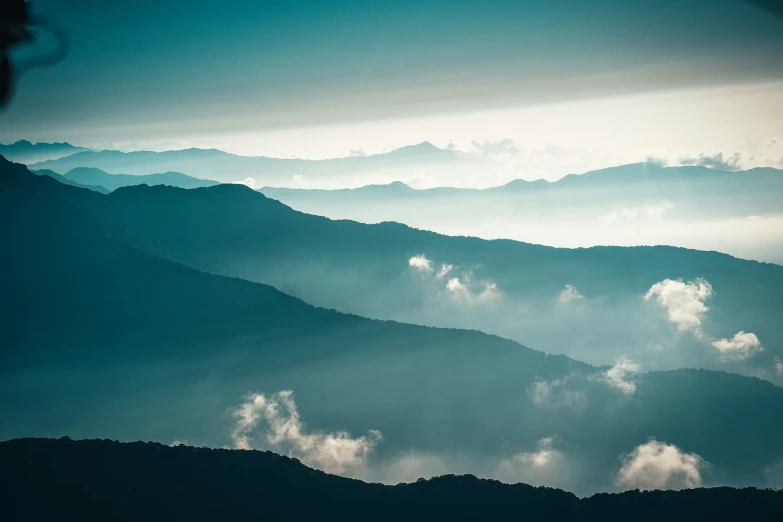 blue and white landscape s of mountains with clouds