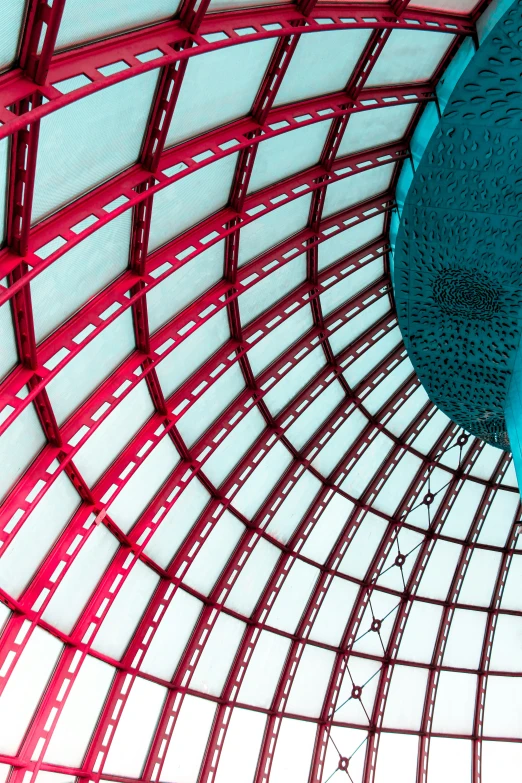 the inside of a large building that is painted blue