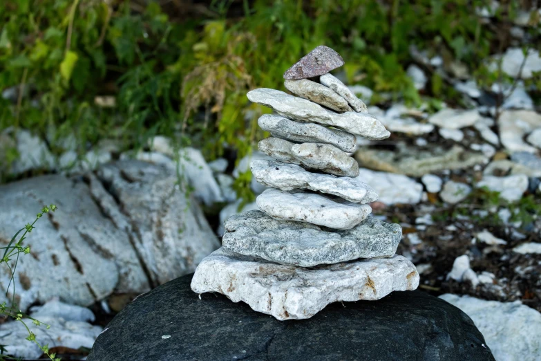 a stack of rocks sitting in a rocky area