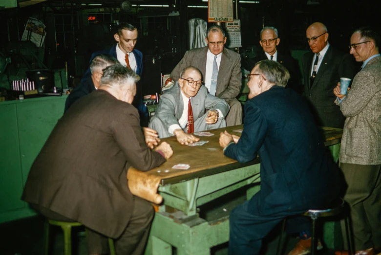 a group of men playing dominoes at a bar