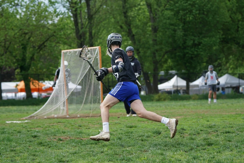 a group of men playing a game of lacrosse