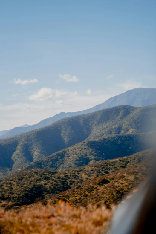 a large area with some grass and hills