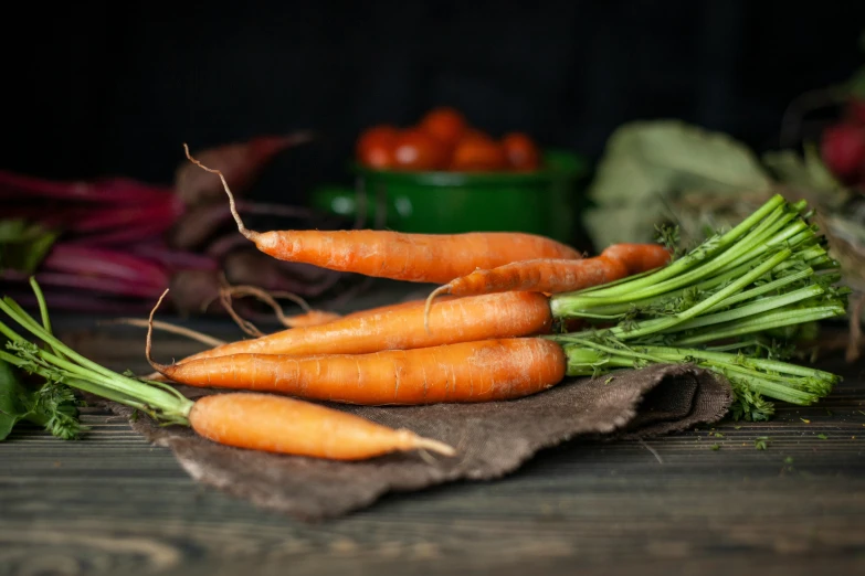 some very bright orange carrots on a table