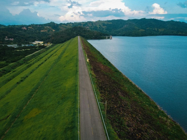 a long stretch of water with trees on the side