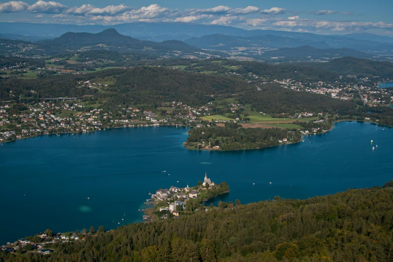 an aerial view of the city and lake