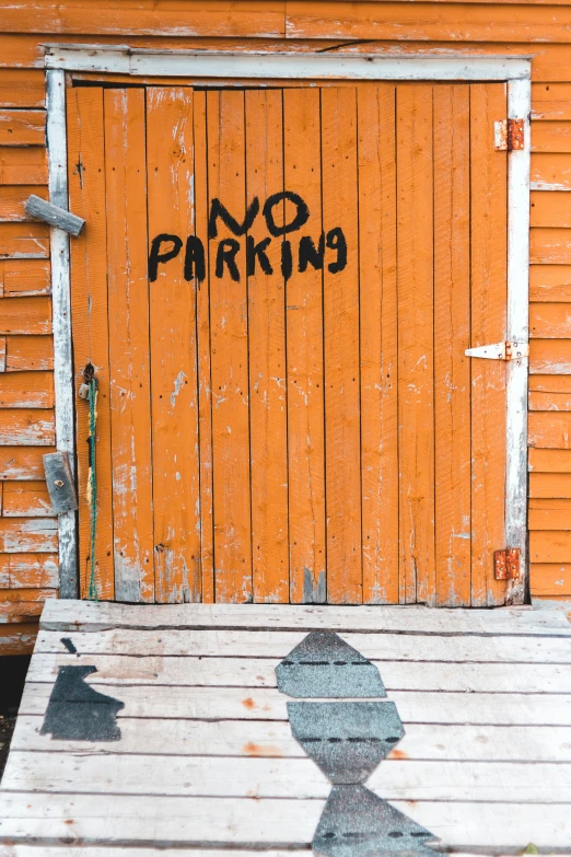 a wooden door with no parking on it