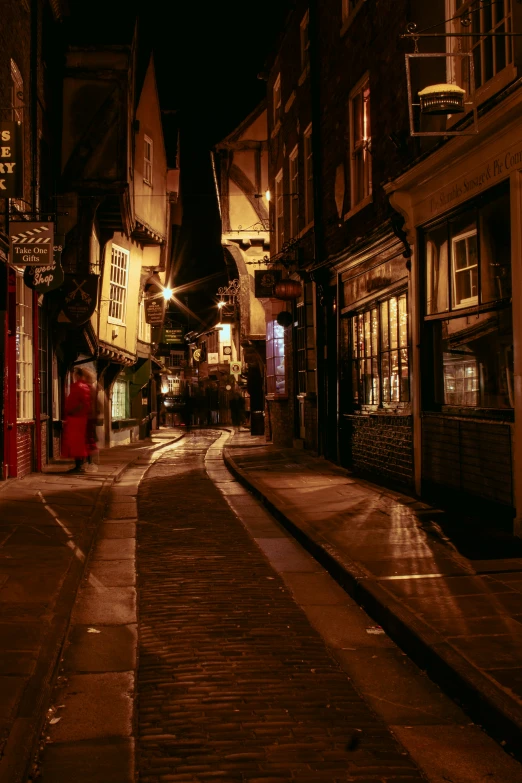an empty street in the old part of town at night