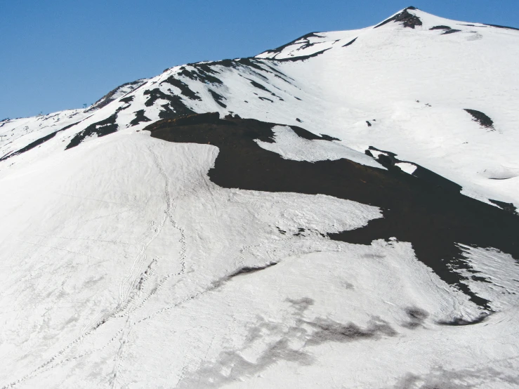 a person on skis riding down a hill