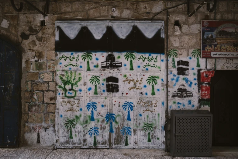 a doorway that has a bunch of graffiti painted on it