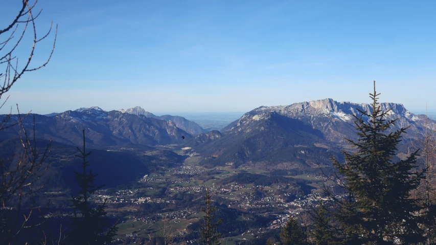 two mountains, one is covered in snow