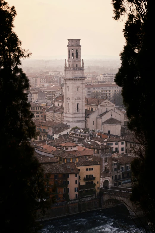 city scene of a clock tower, and a small waterway