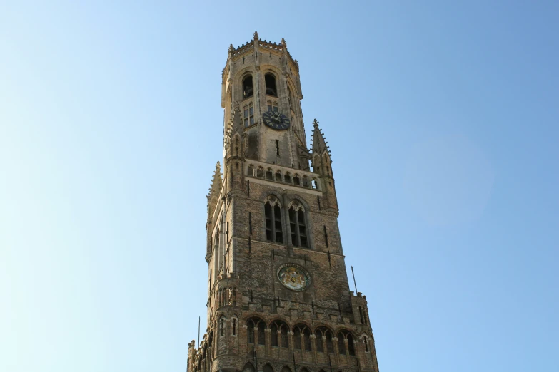 a very tall building has two clocks on each of it