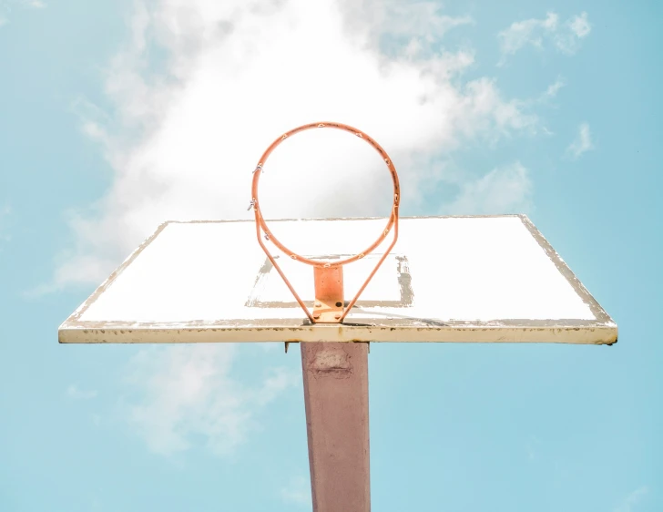 a hoop that is in the air with a ball inside