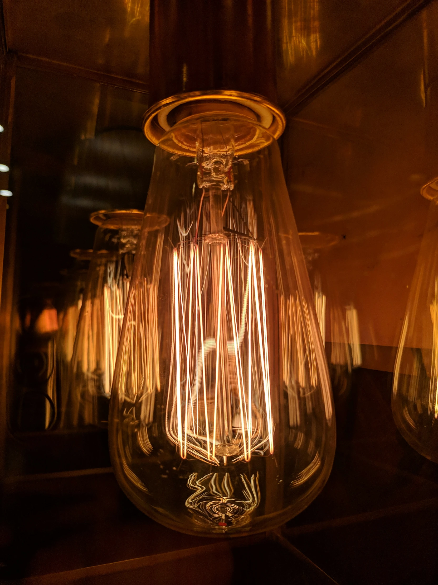 a light bulb with some electrical wires coming out