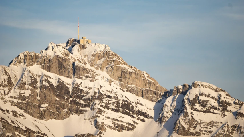 a snow covered mountain is seen in this image