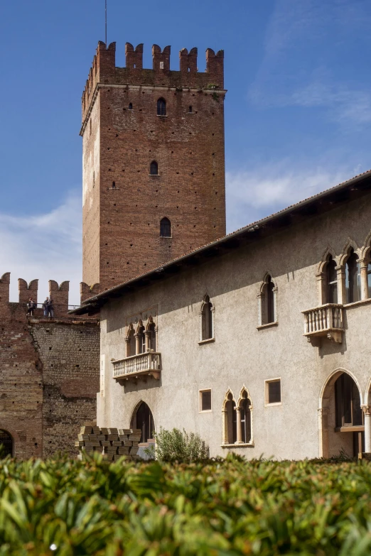 the outside of an old building with a tower on top