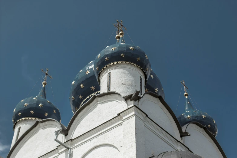 a white and blue building is shown against the sky