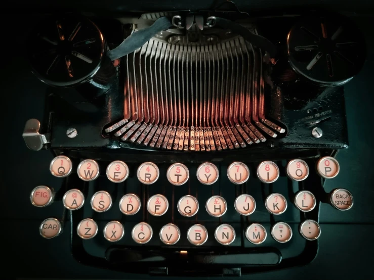 an old fashioned typewriter with a lit up light